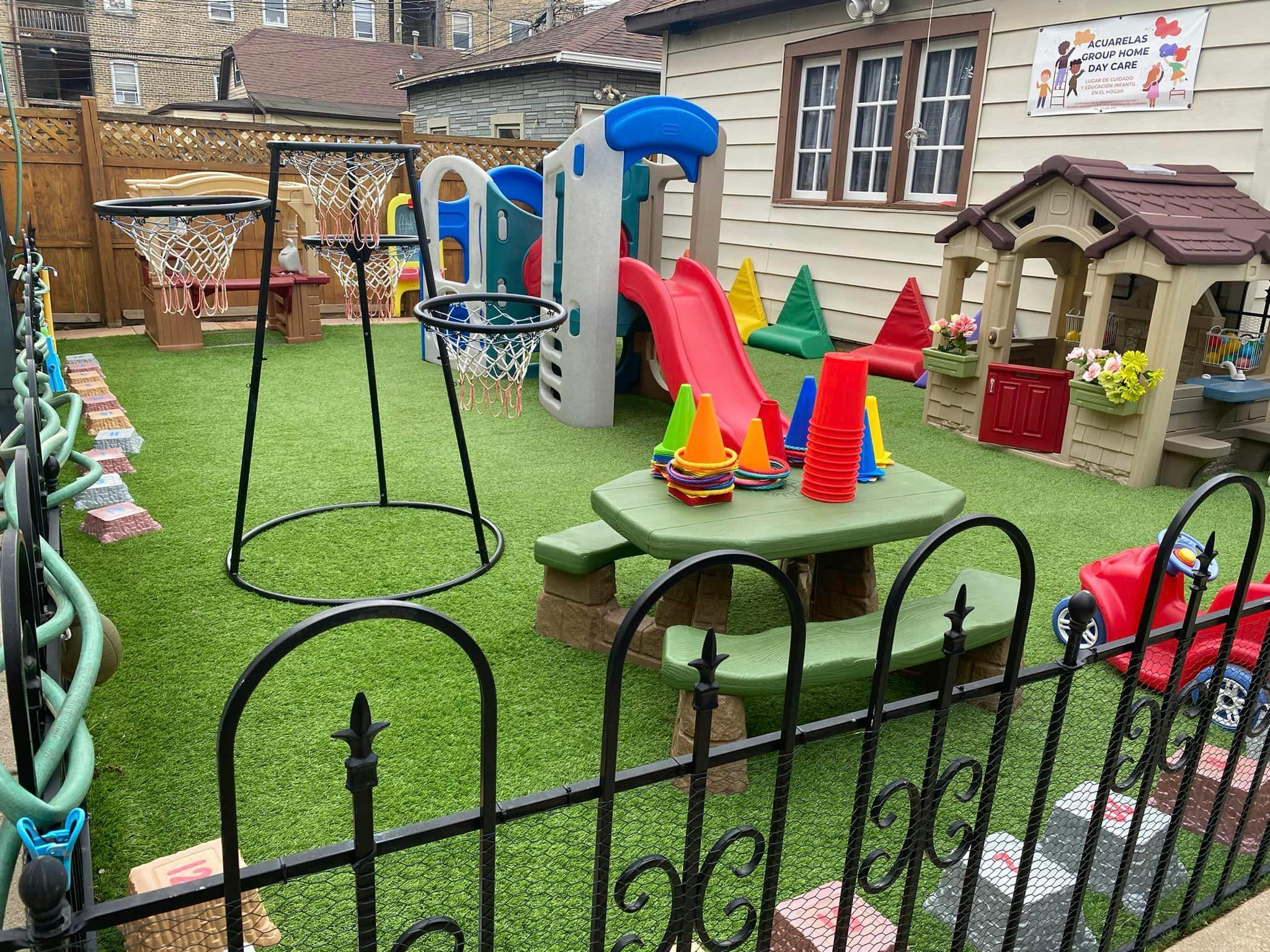 Outdoor playground with slides, basketball hoops, and a picnic table