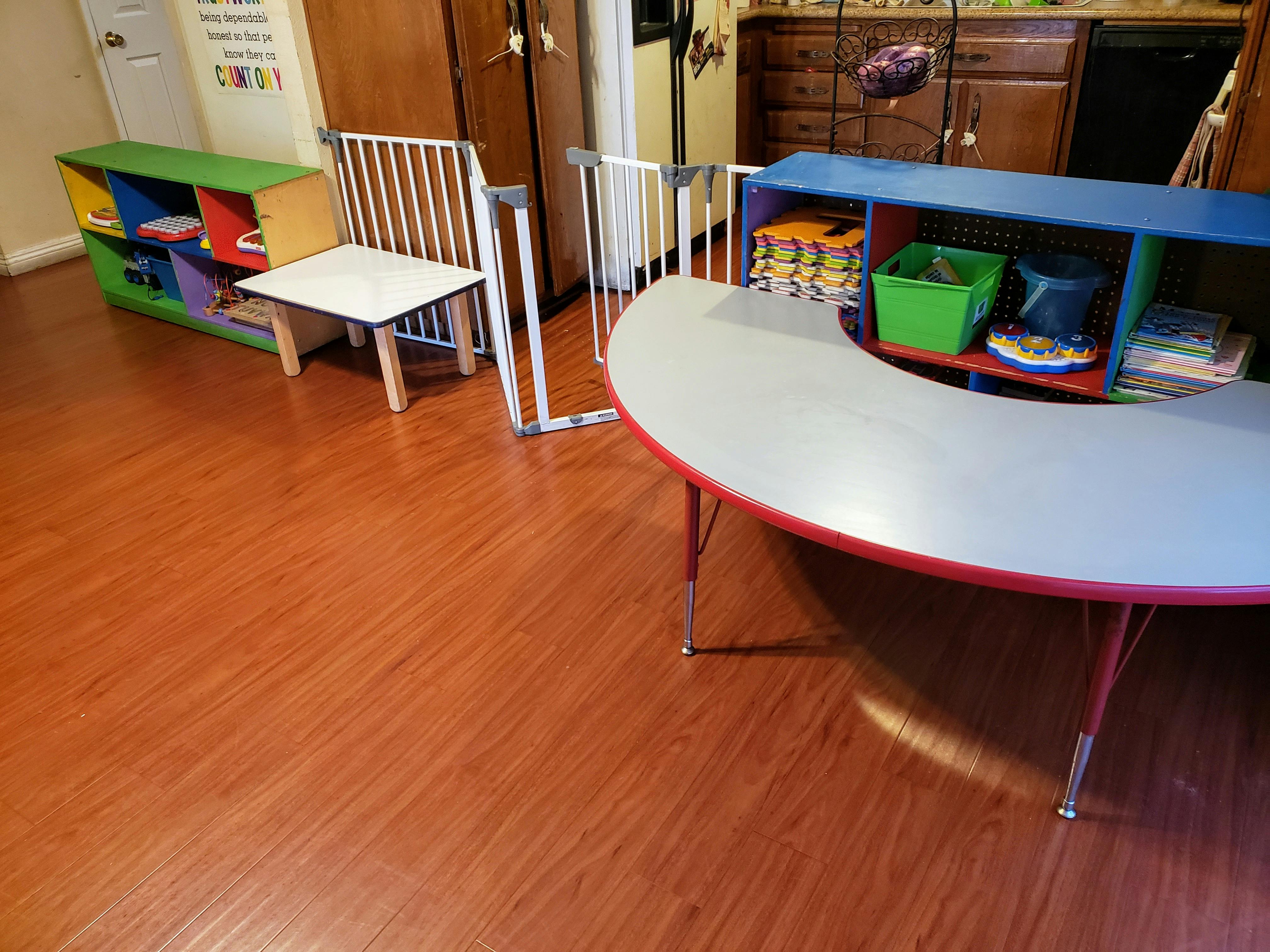 Child safety gates and tables in a room