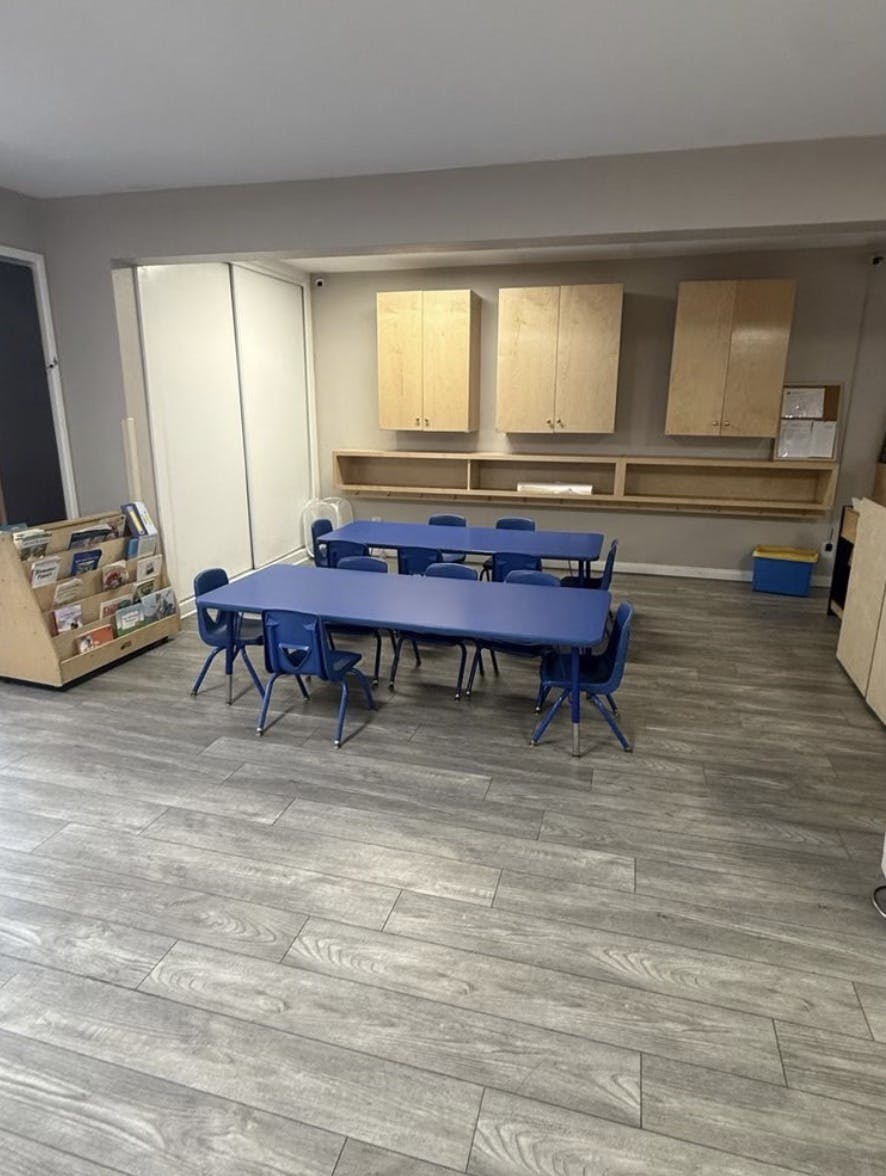 Classroom with blue tables and chairs