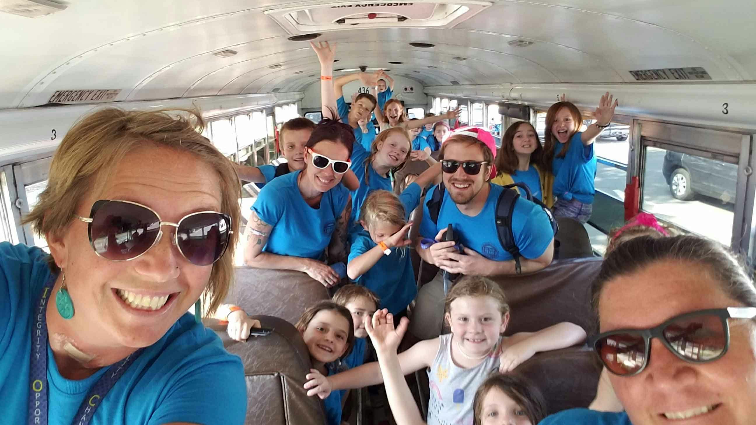 Group of people and children in a bus