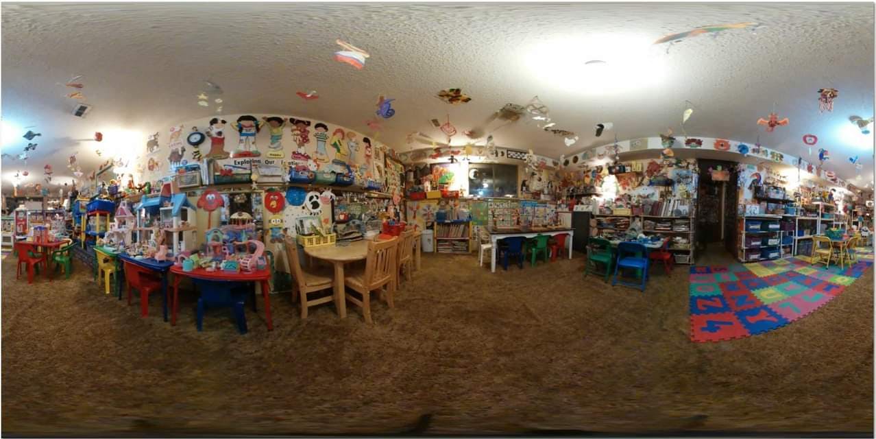 Interior of a room filled with toys and small tables