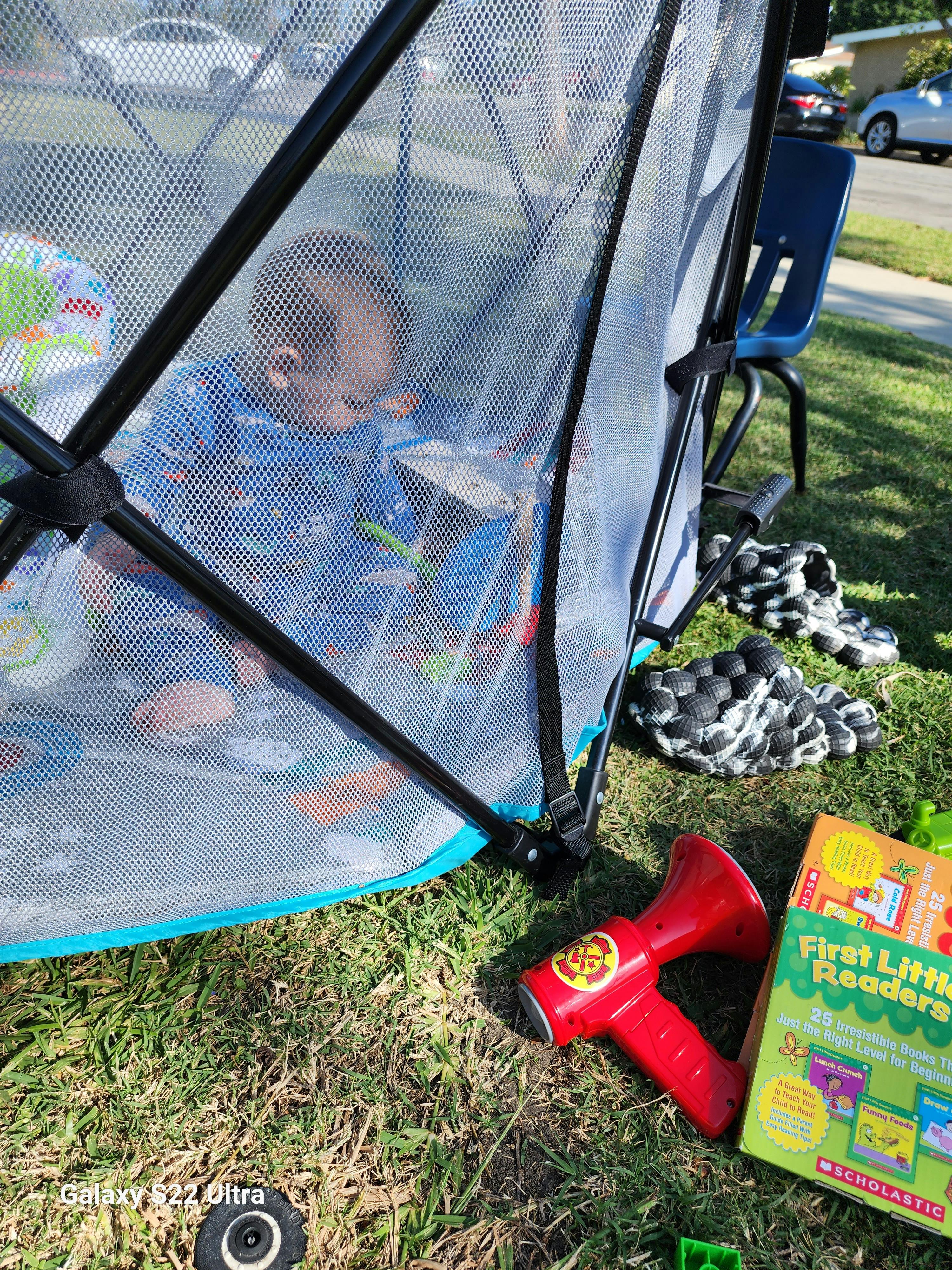 Child in a playpen outdoors