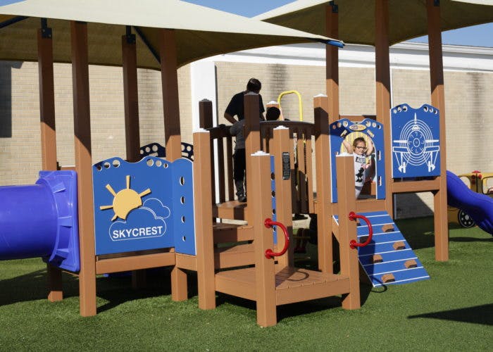 Playground with a person and a child