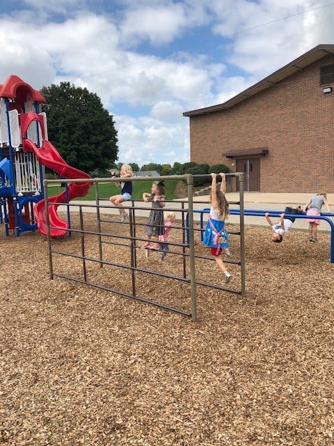 Children playing on playground equipment