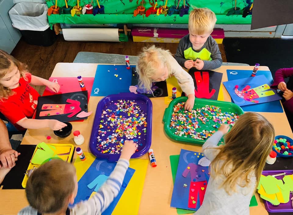 Children doing crafts at a table