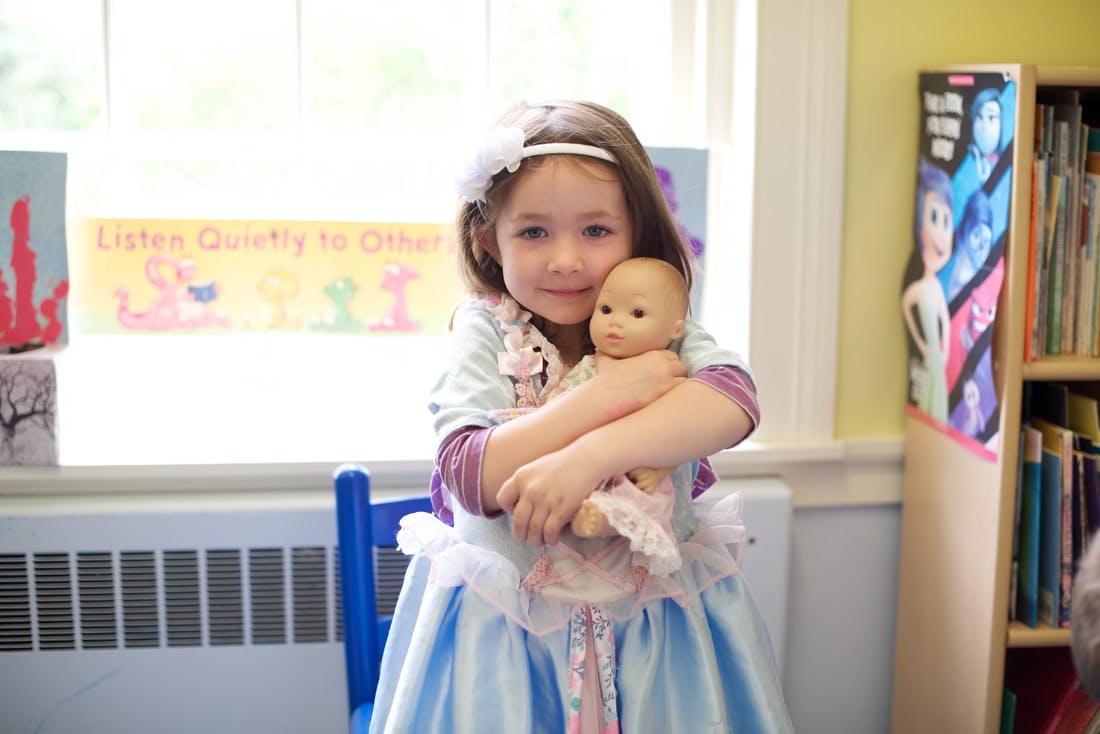 Child holding a doll