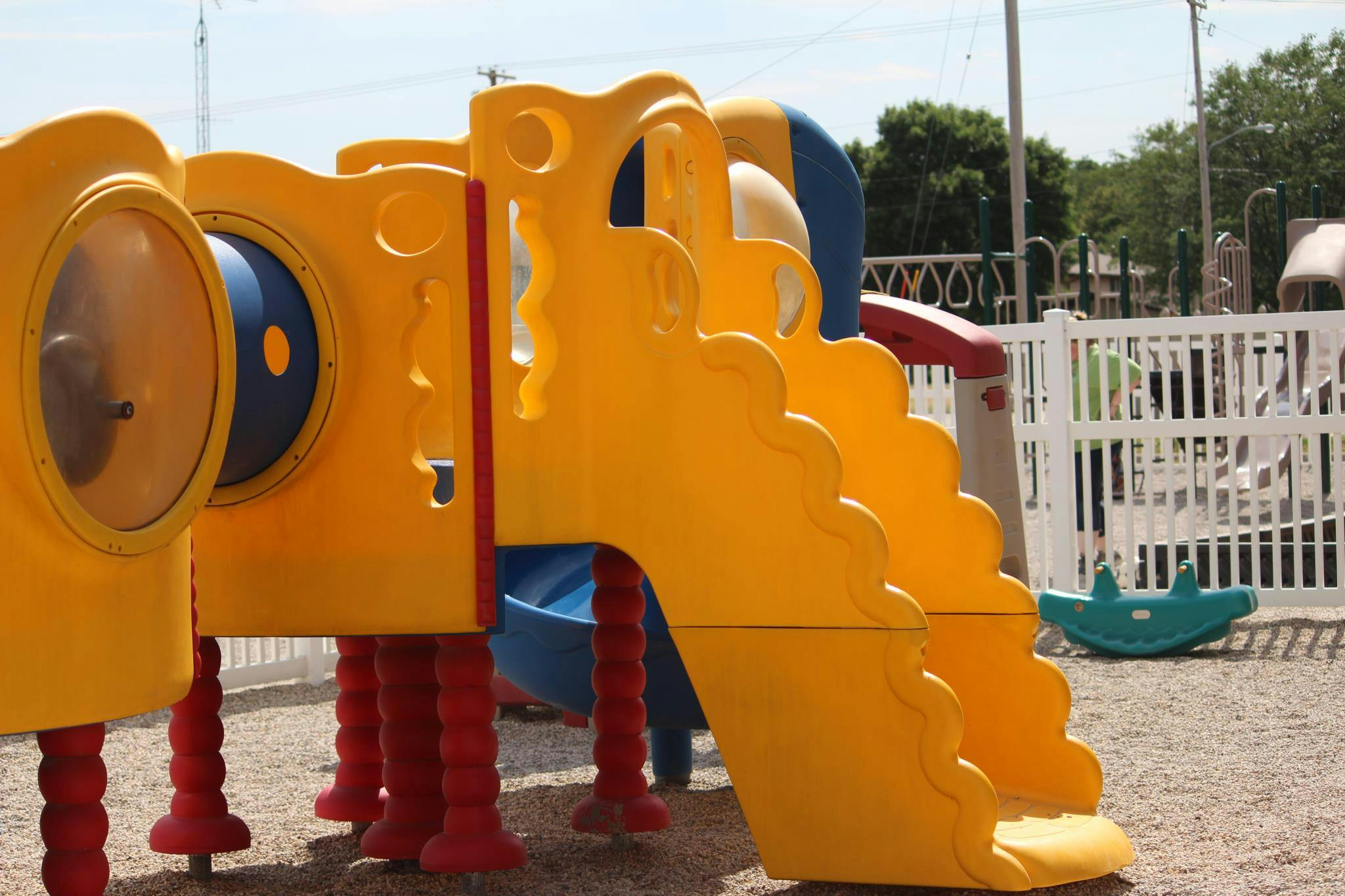 Yellow playground slide and climbing structure