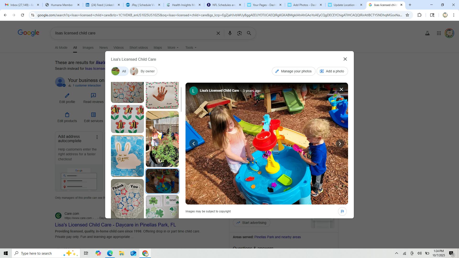 Two children playing at a water table outdoors