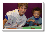 Two children painting