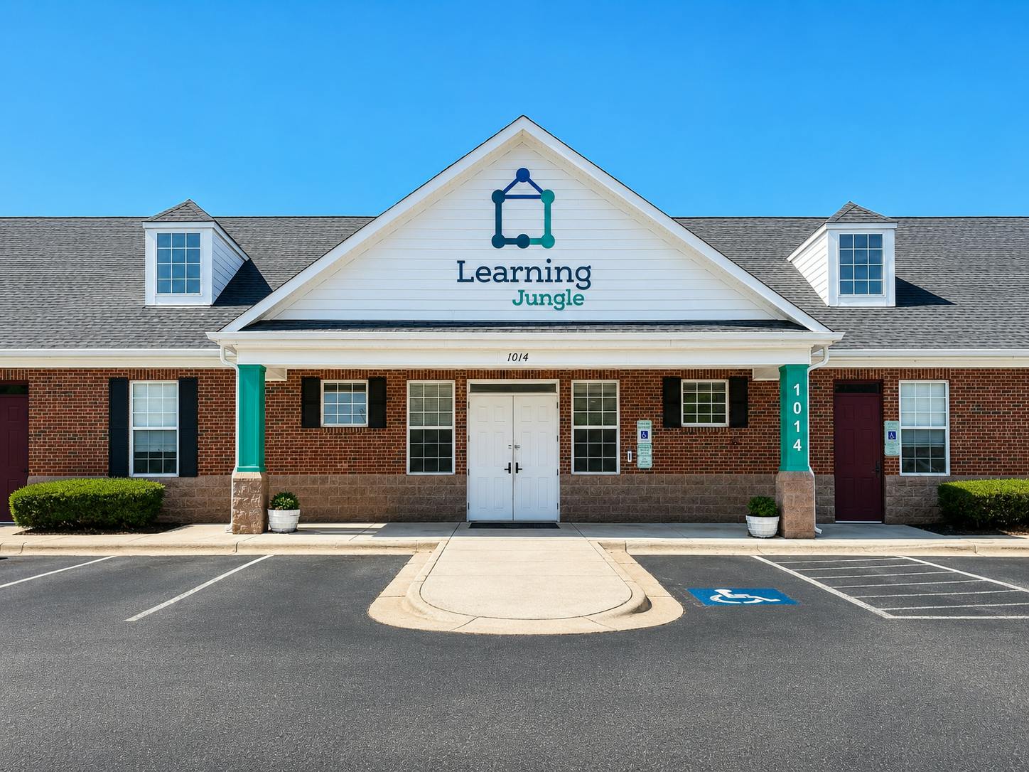 Exterior of Learning Jungle childcare facility with brick facade and parking lot