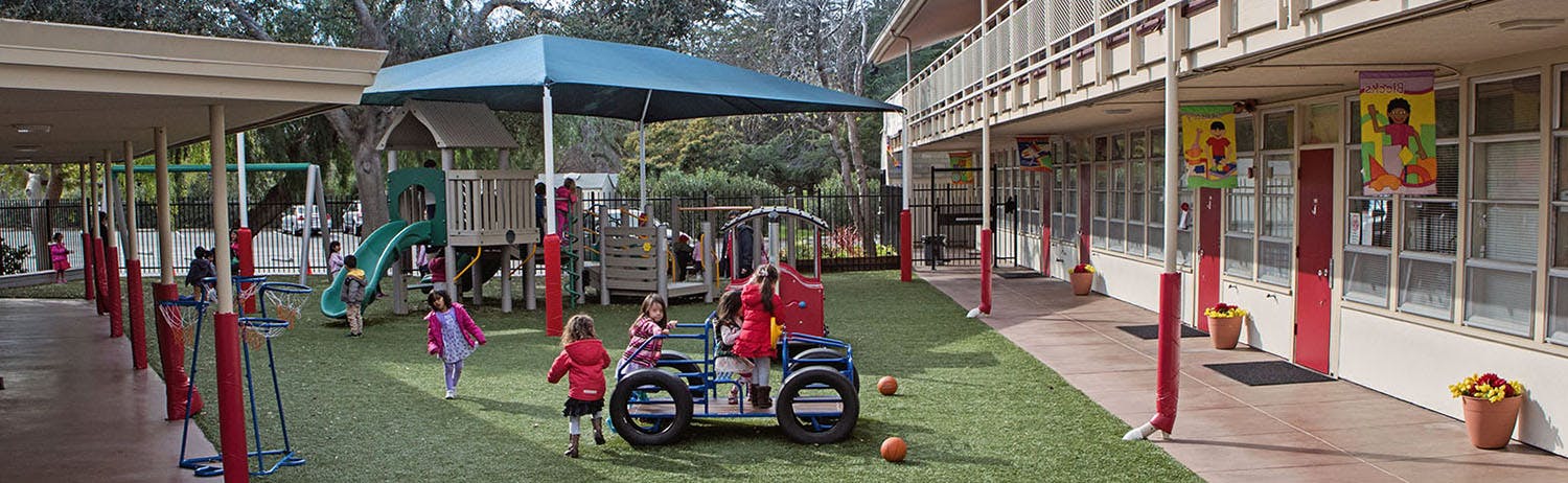 Children playing on a playground at a school