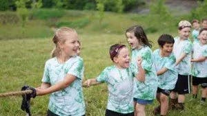 Children playing tug of war outdoors