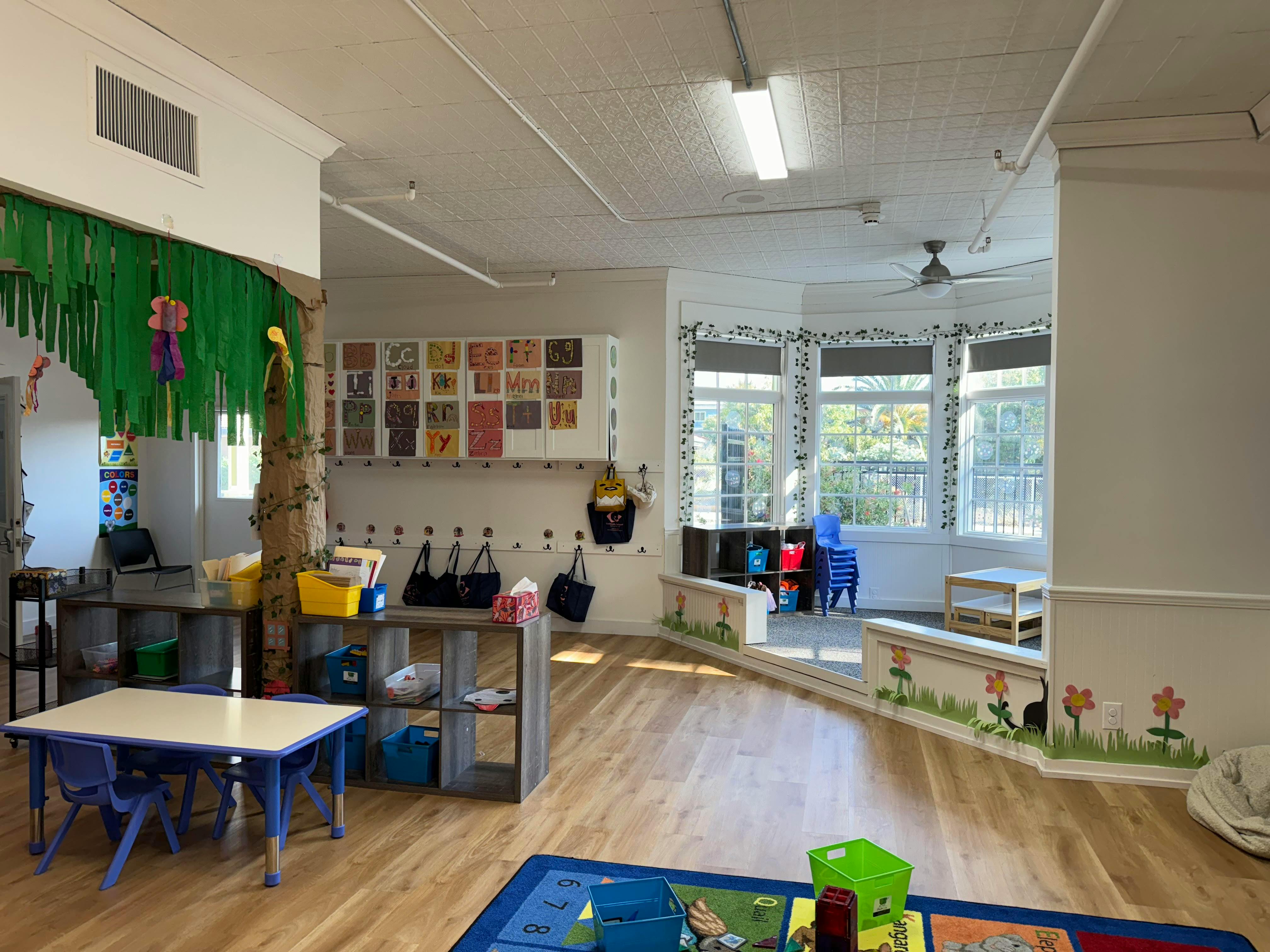 Empty classroom with small tables and chairs