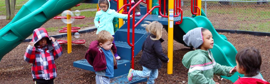 Children playing on a playground structure