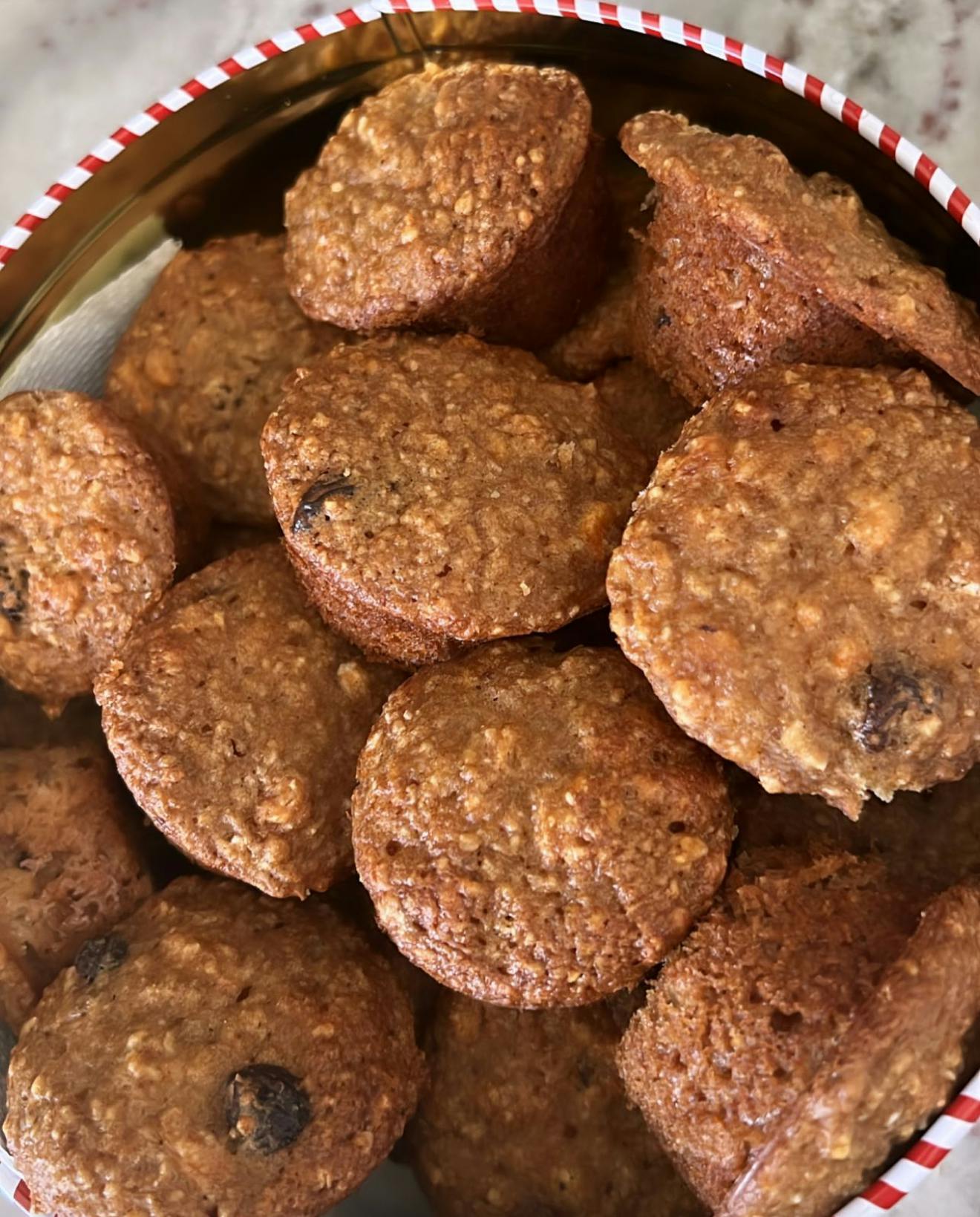 Close up of many small baked goods in a tin