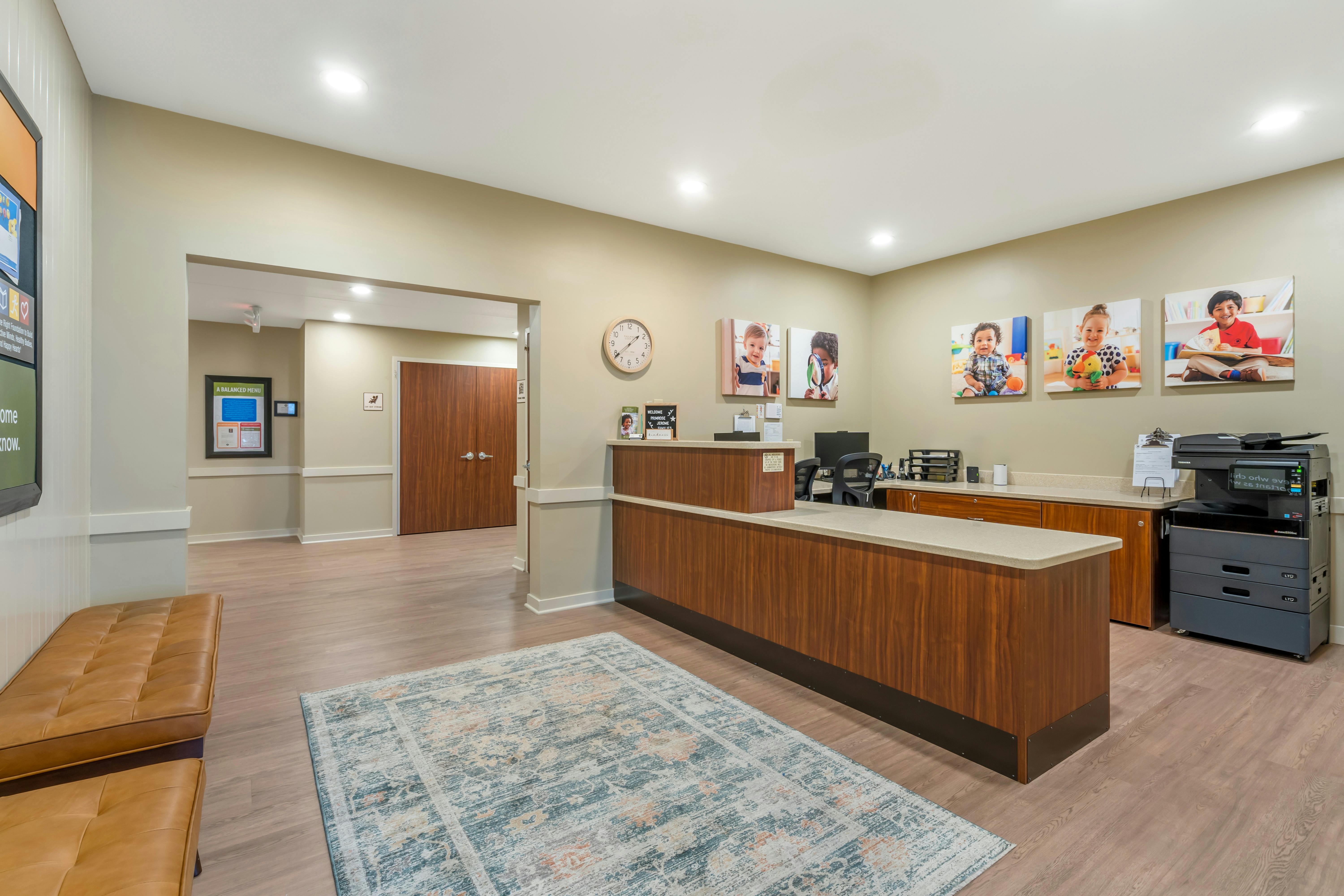 Reception desk with wood paneling and beige countertop