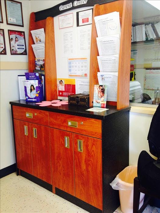Parent Center information display with brochures and storage cabinet