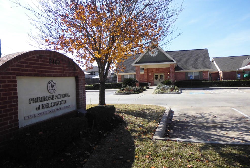 Primrose School of Kingwood sign in front of a building
