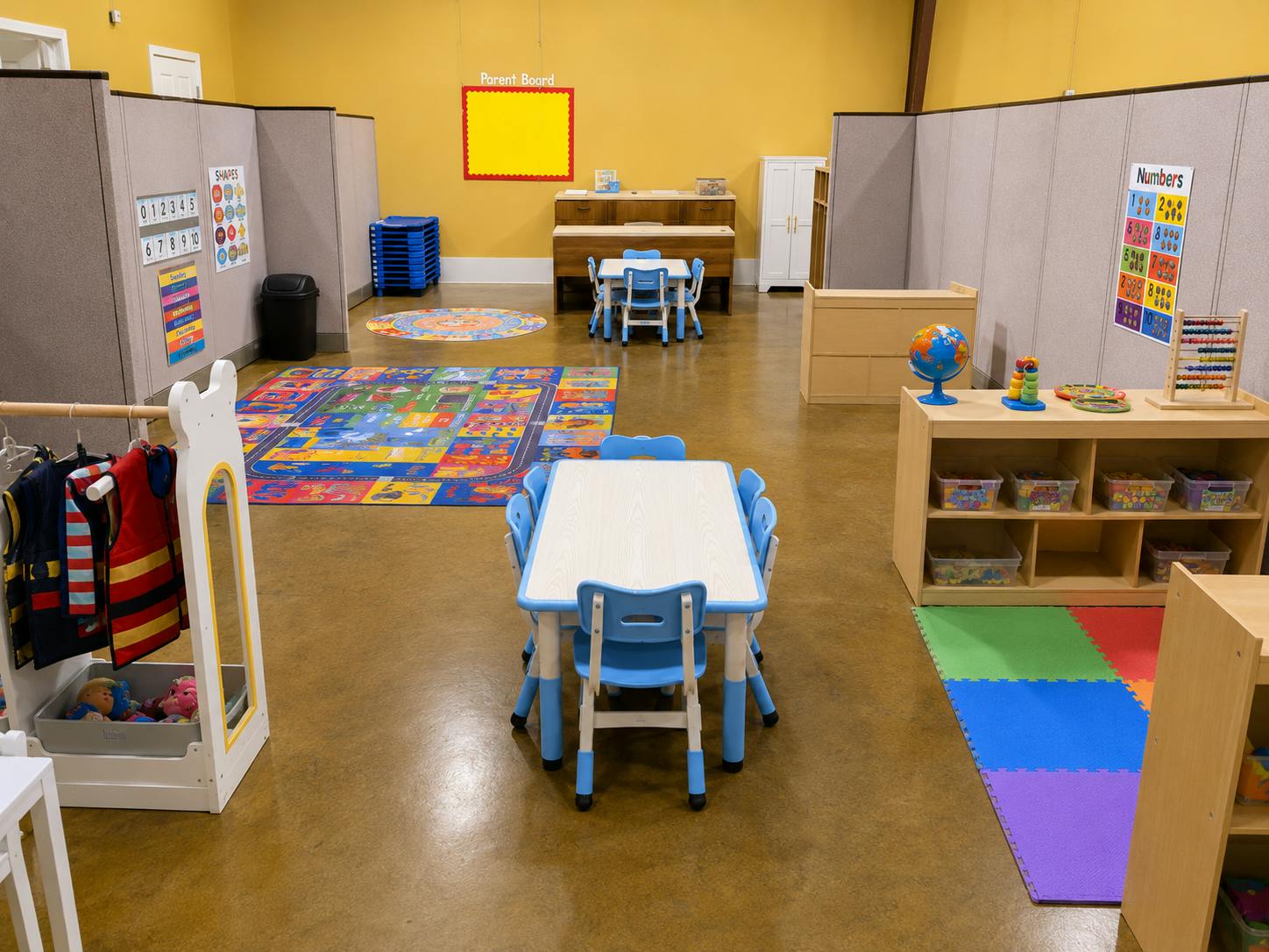 Classroom interior with small tables chairs and educational play areas