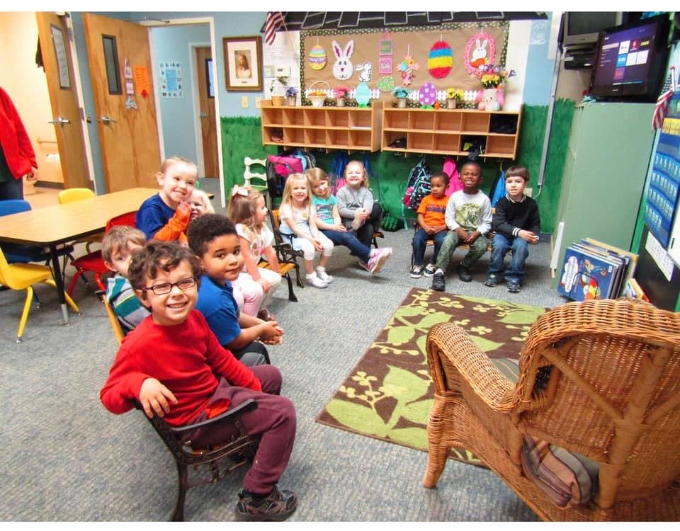 Group of children sitting in a classroom