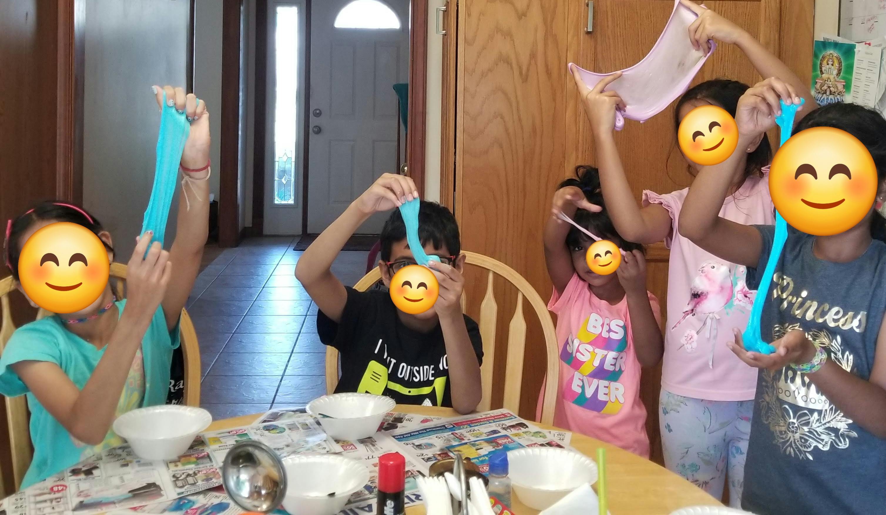 Children playing with slime at a table