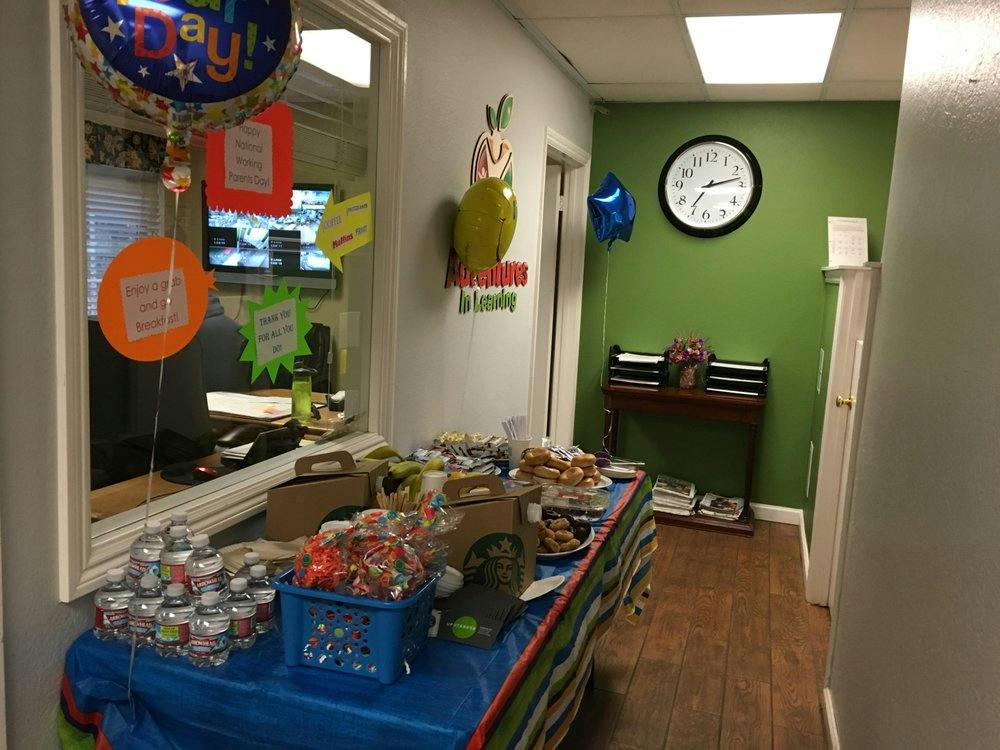 Table with snacks and drinks in a room with green and white walls