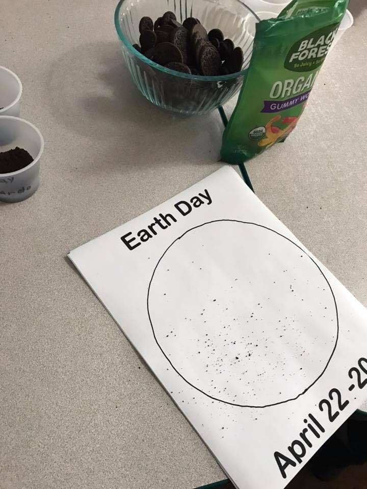 Earth Day paper with a circle, cups, and candy