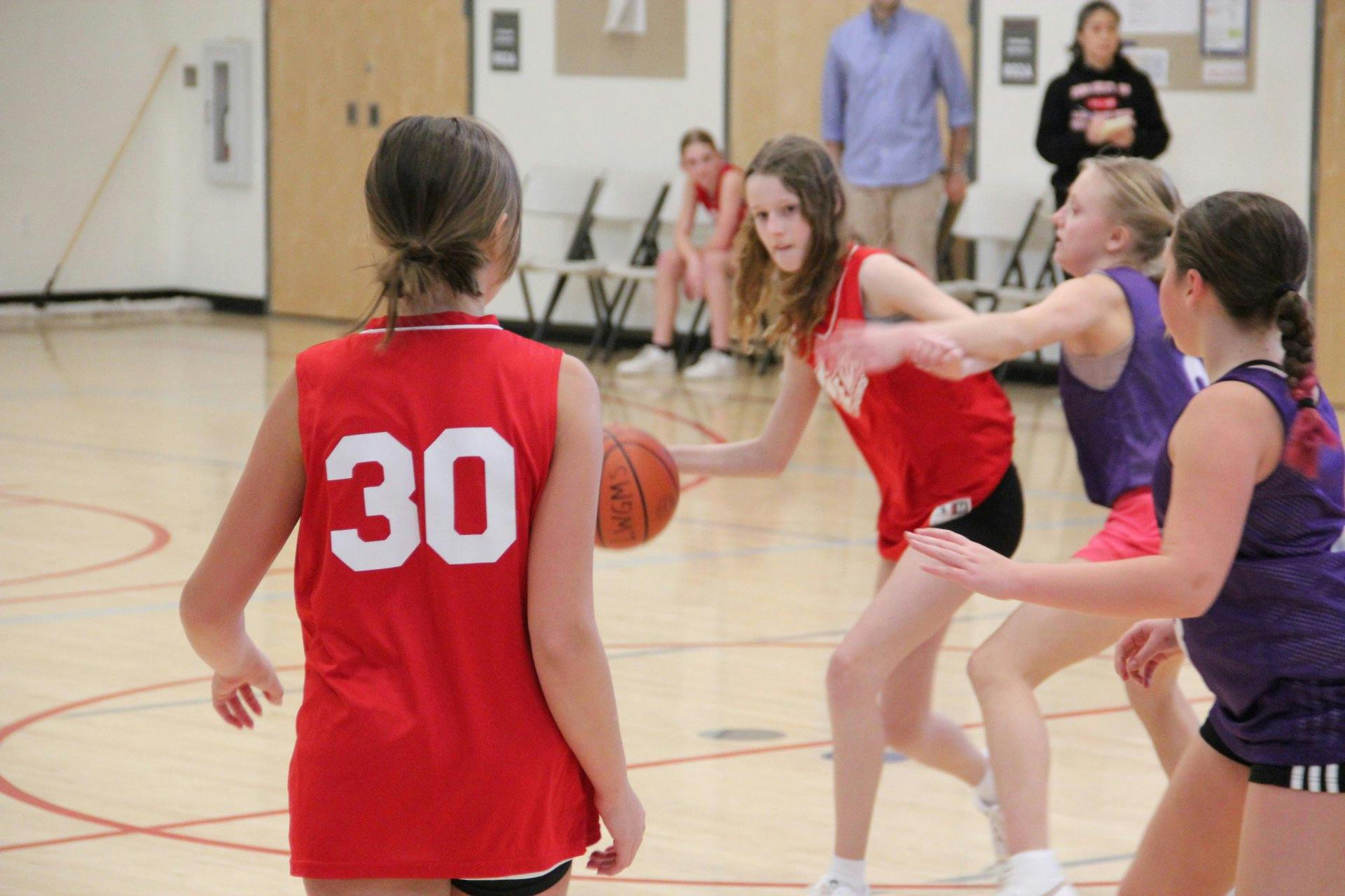 People playing basketball indoors