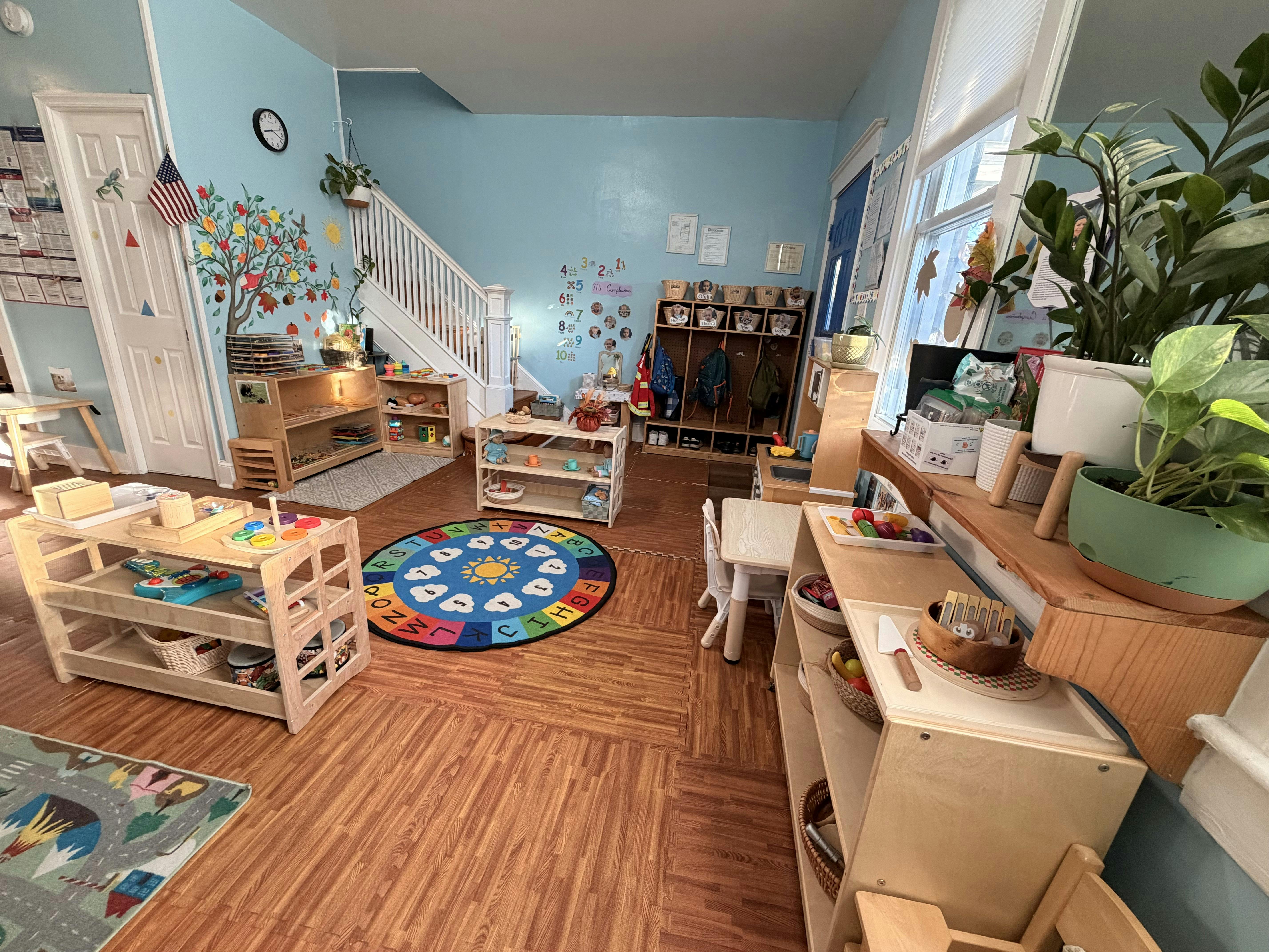 Interior of a colorful preschool classroom with educational toys and furniture