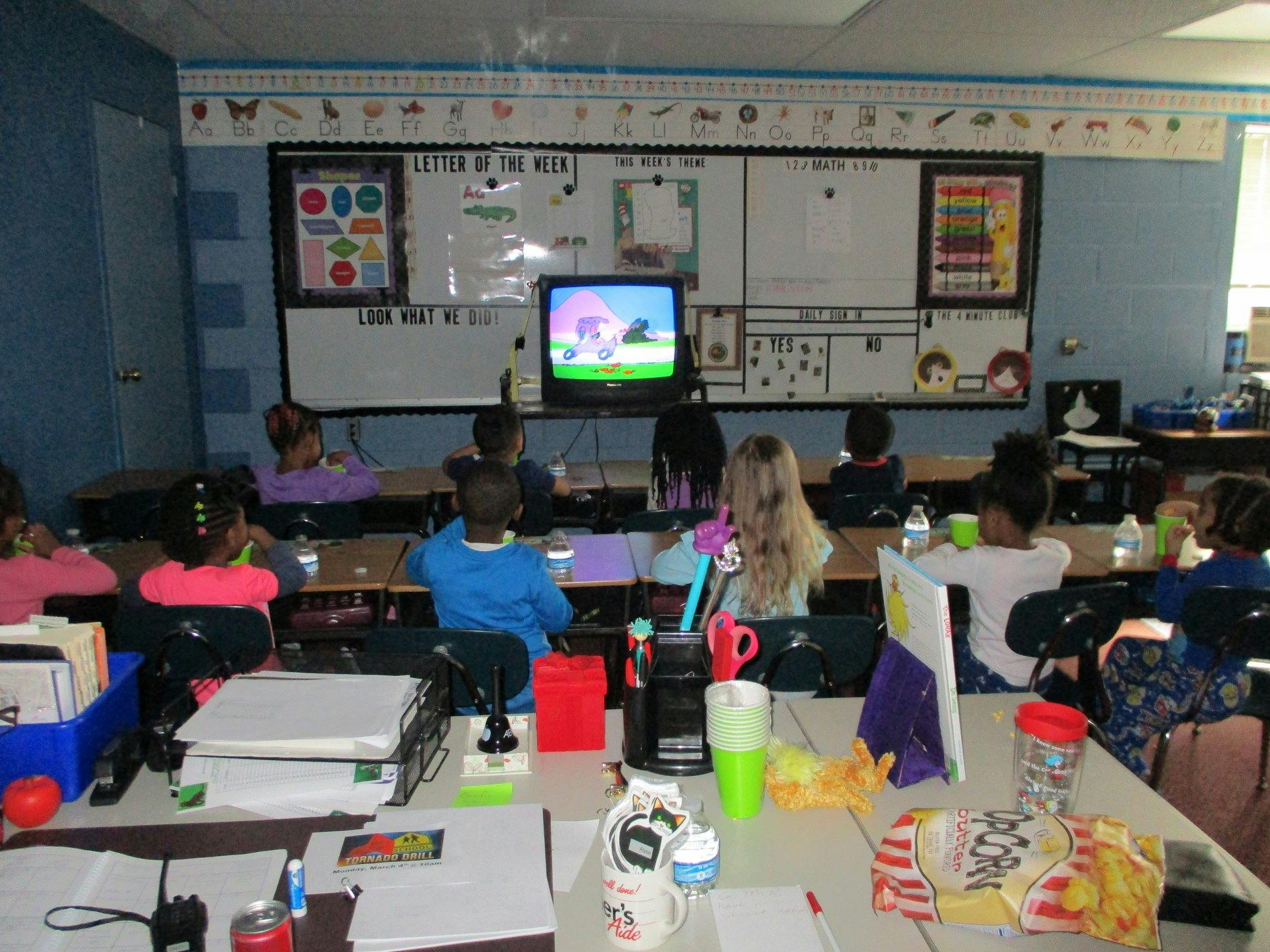 Children watching a television in a classroom