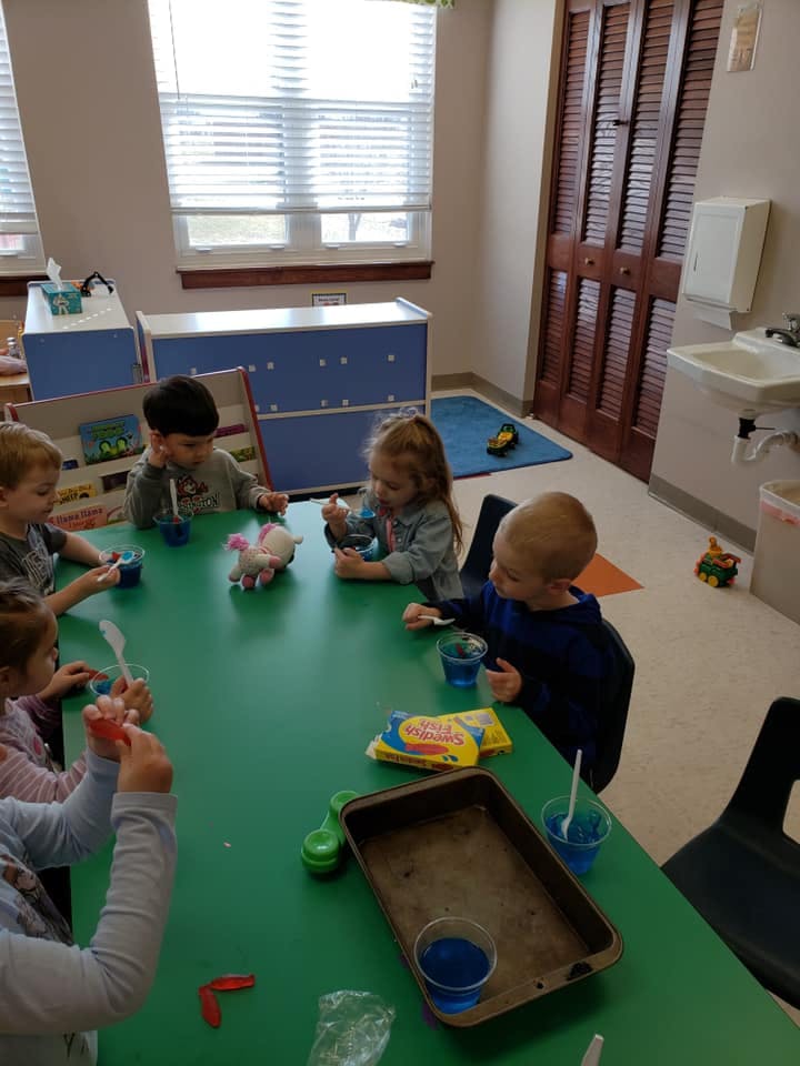 Children at a table in a classroom