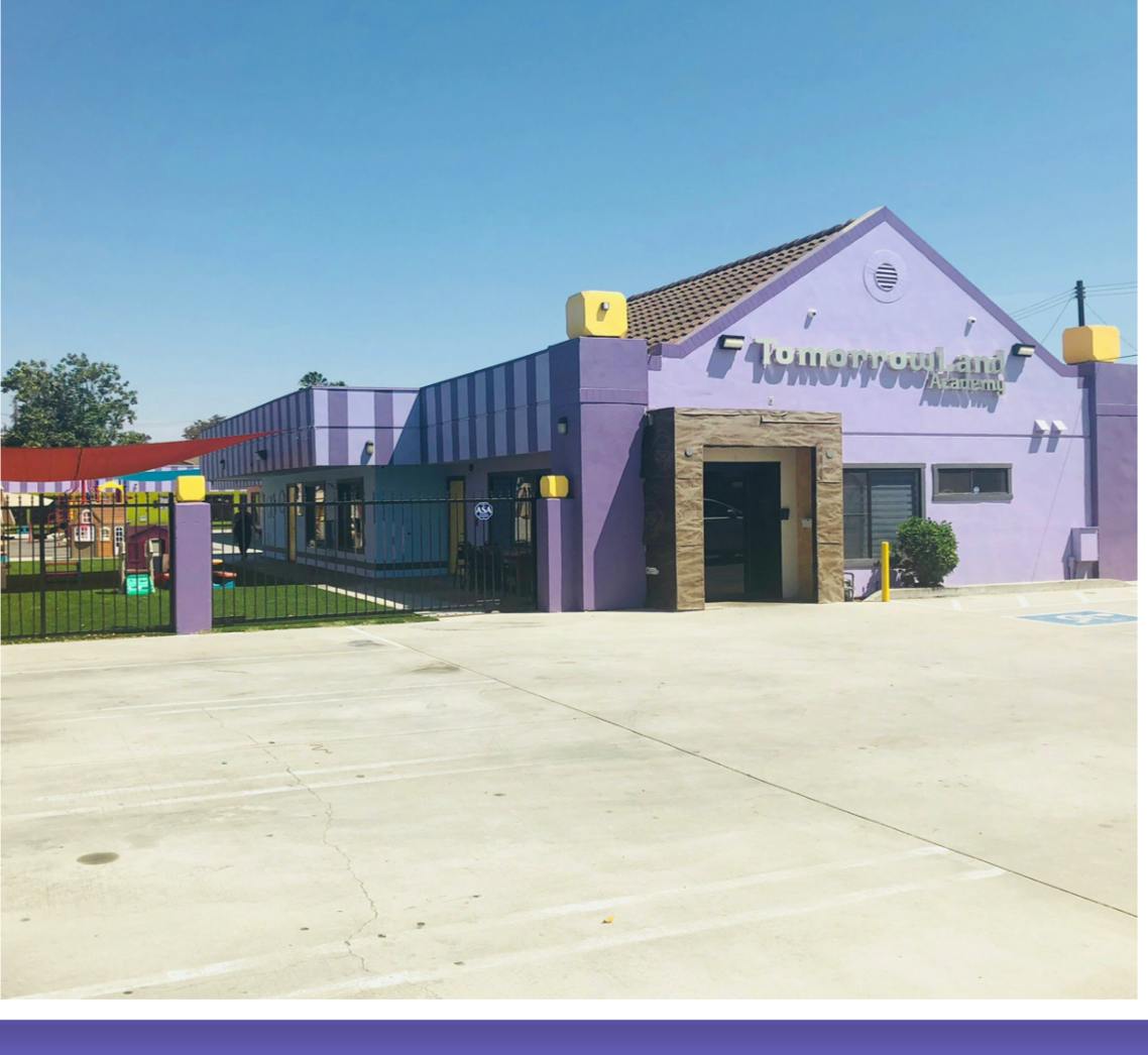 Purple building with "Tomorrow's Child Academy" on the facade