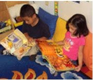 Two children reading books