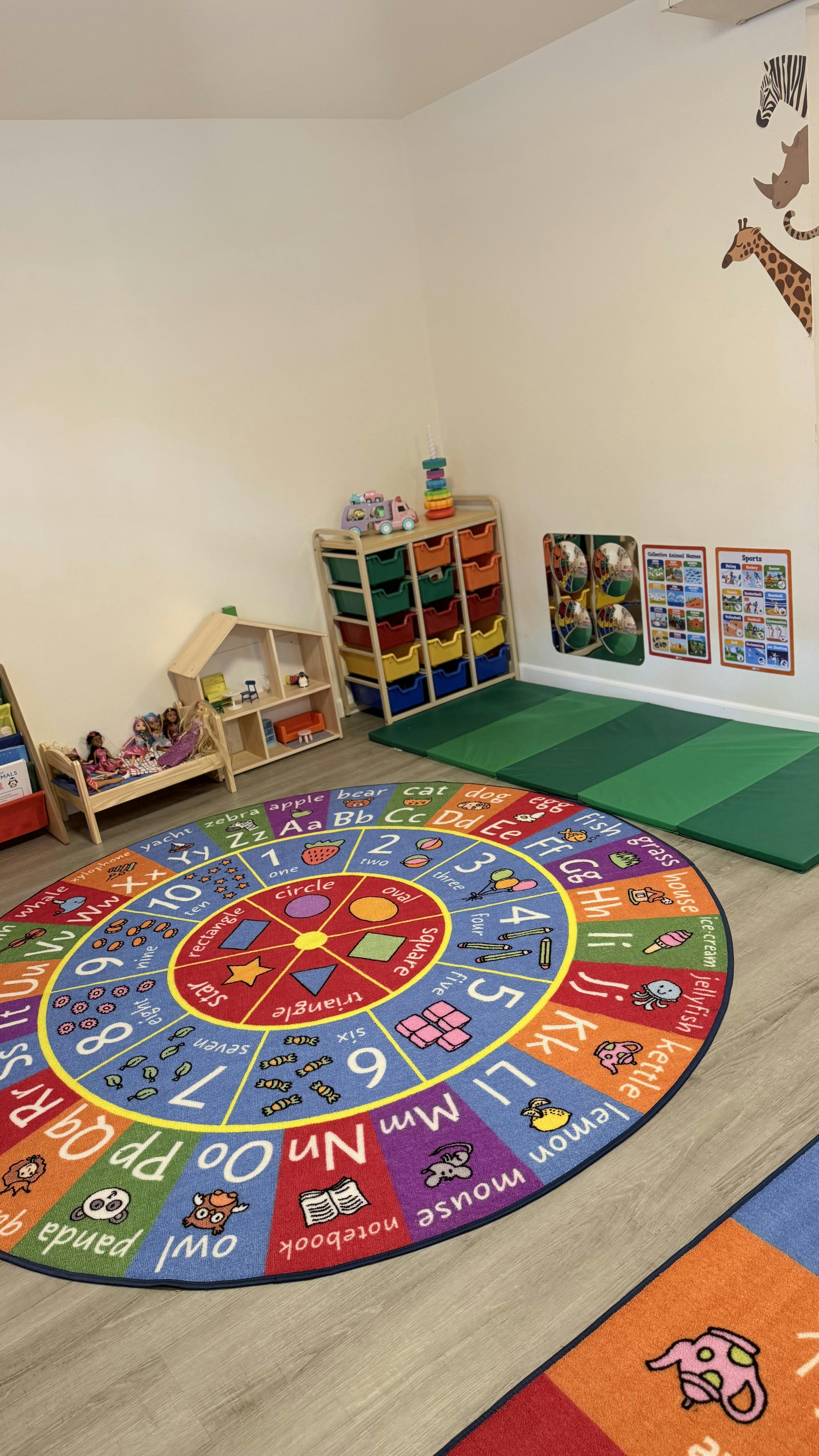 Colorful educational rug with letters and numbers in a children play area