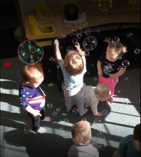 Children playing with bubbles