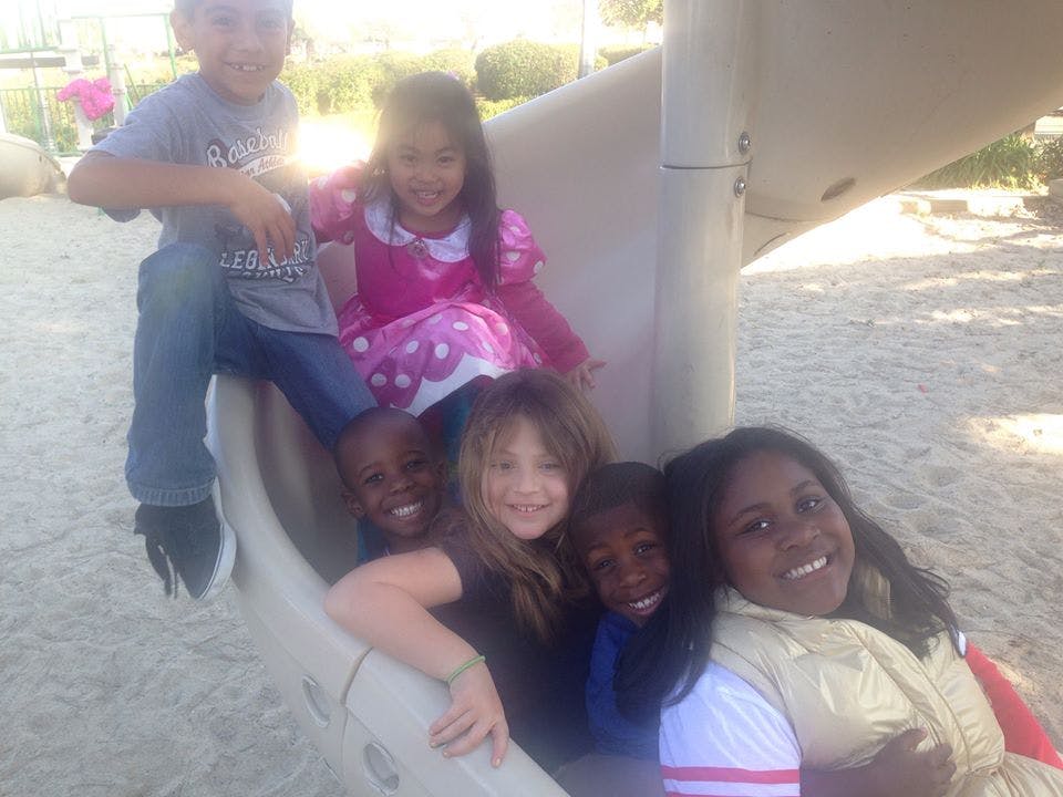Group of children on a playground slide