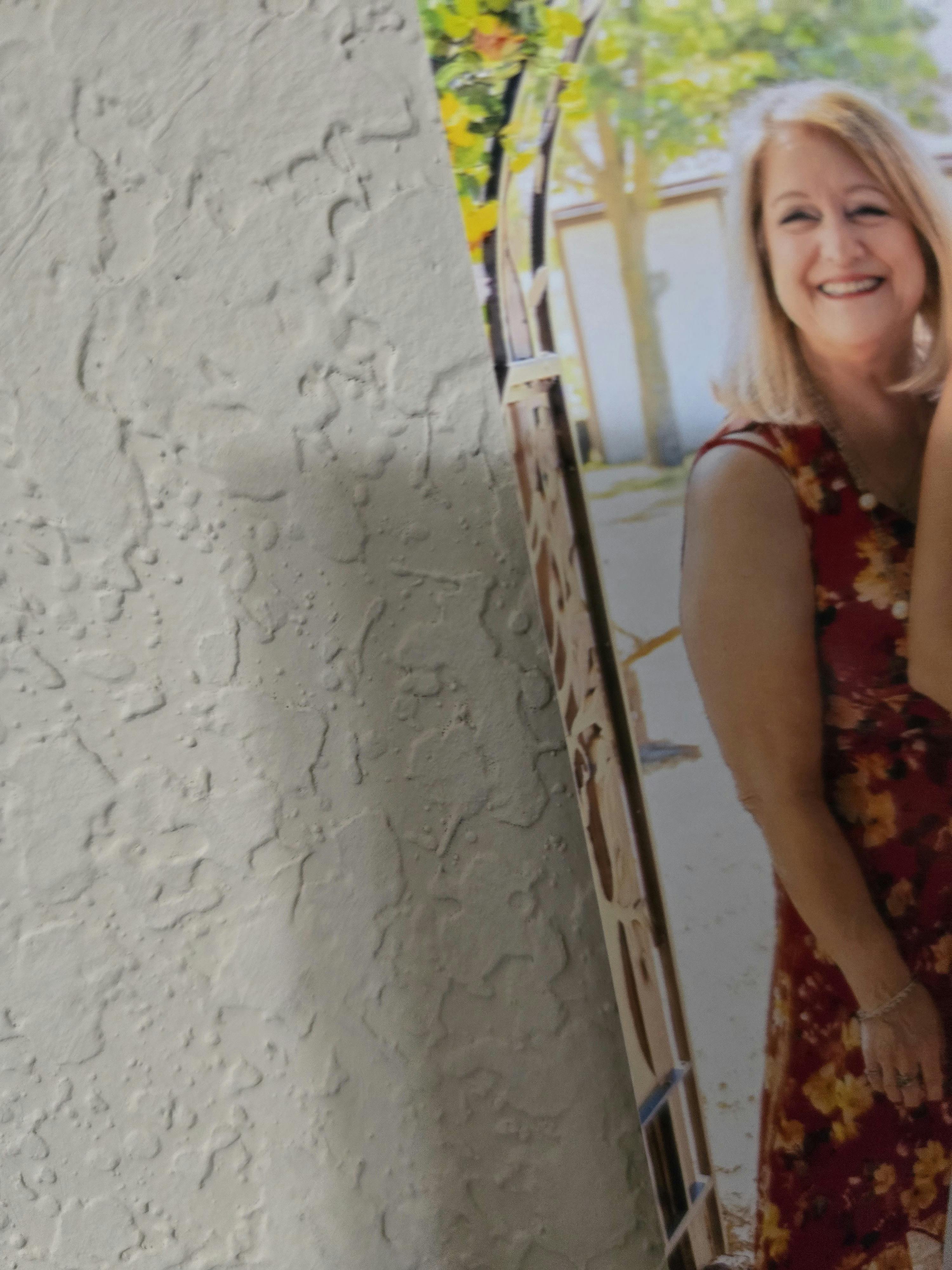 Person in a floral dress smiling