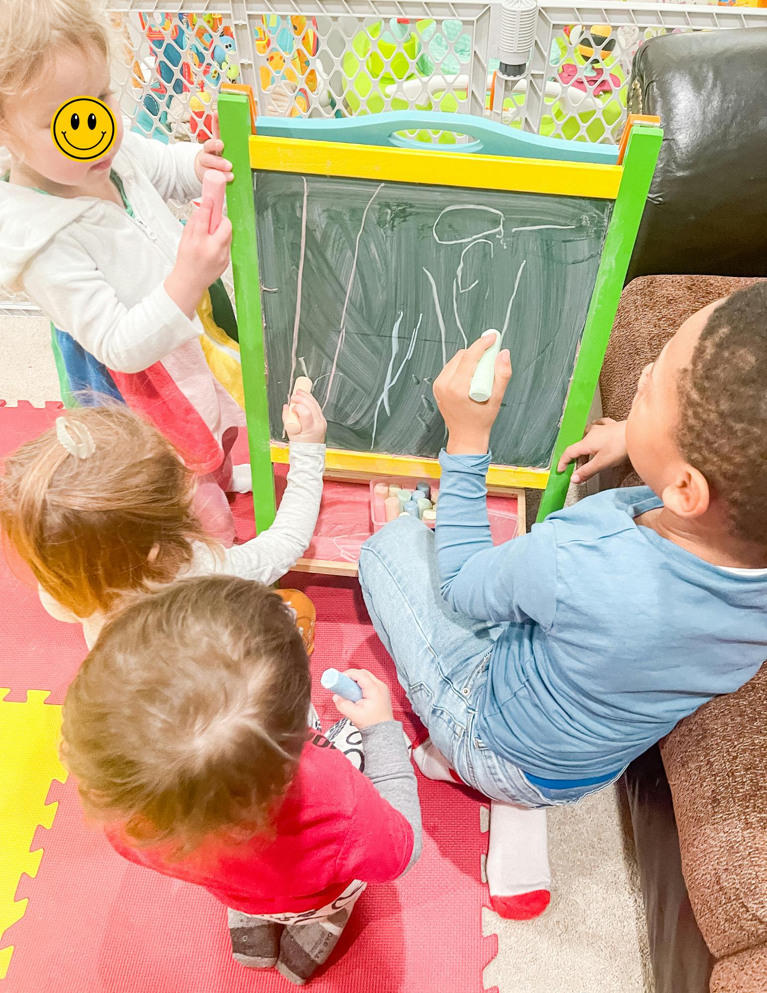 Children drawing on a chalkboard
