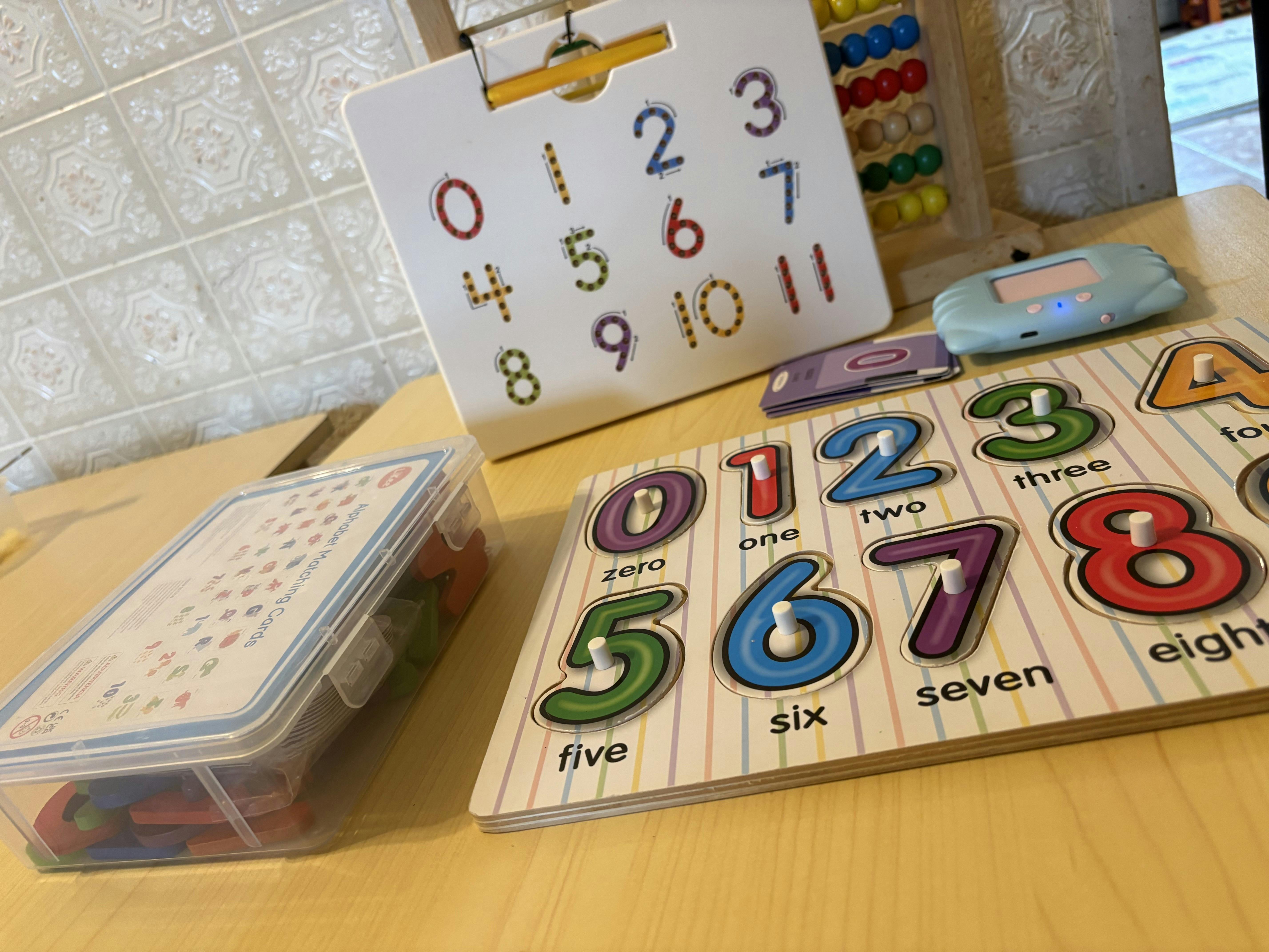 Number puzzles and educational toys on a wooden surface