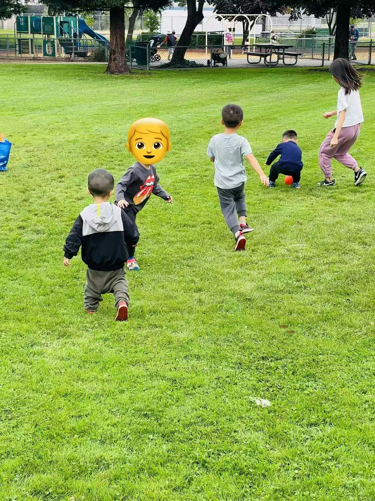 Children playing on a grassy field