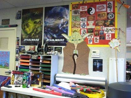 Star Wars posters and a Yoda cutout in a classroom