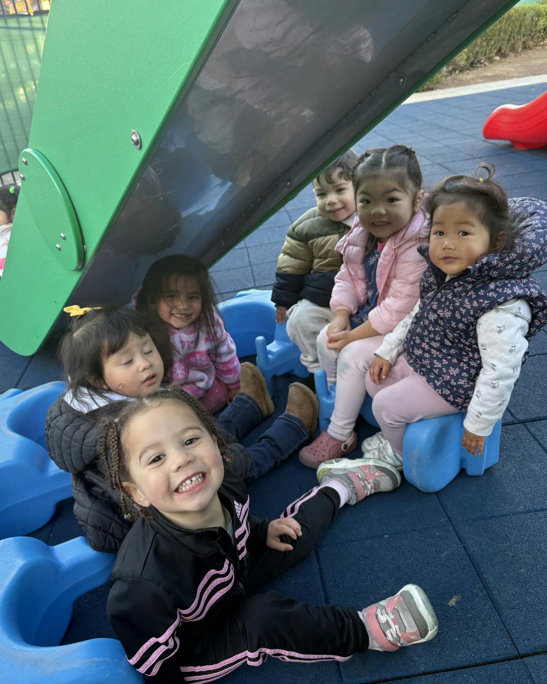 Group of children playing together on a playground