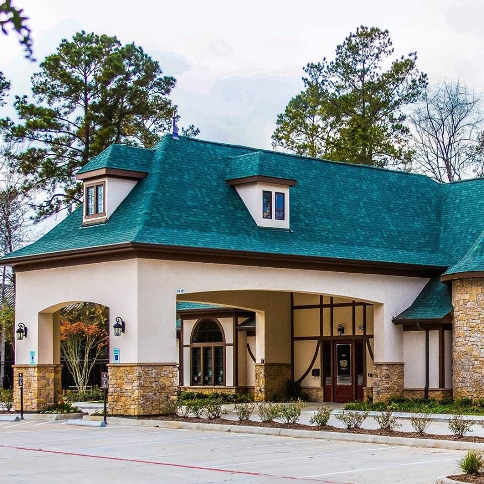 Building with a green roof and drive-through entrance
