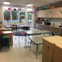 Empty classroom with tables and chairs