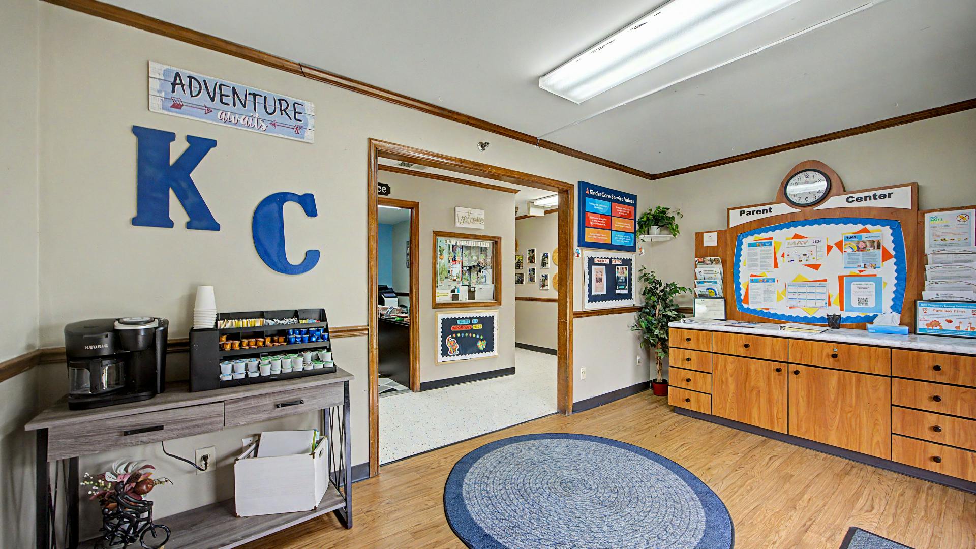 Lobby area with a coffee maker, bulletin boards, and cubbies