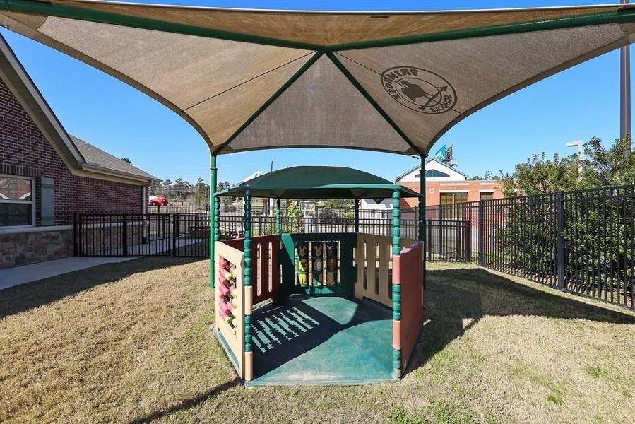 Playground structure with a shade canopy over it