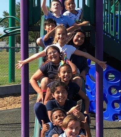 Group of children on a playground slide