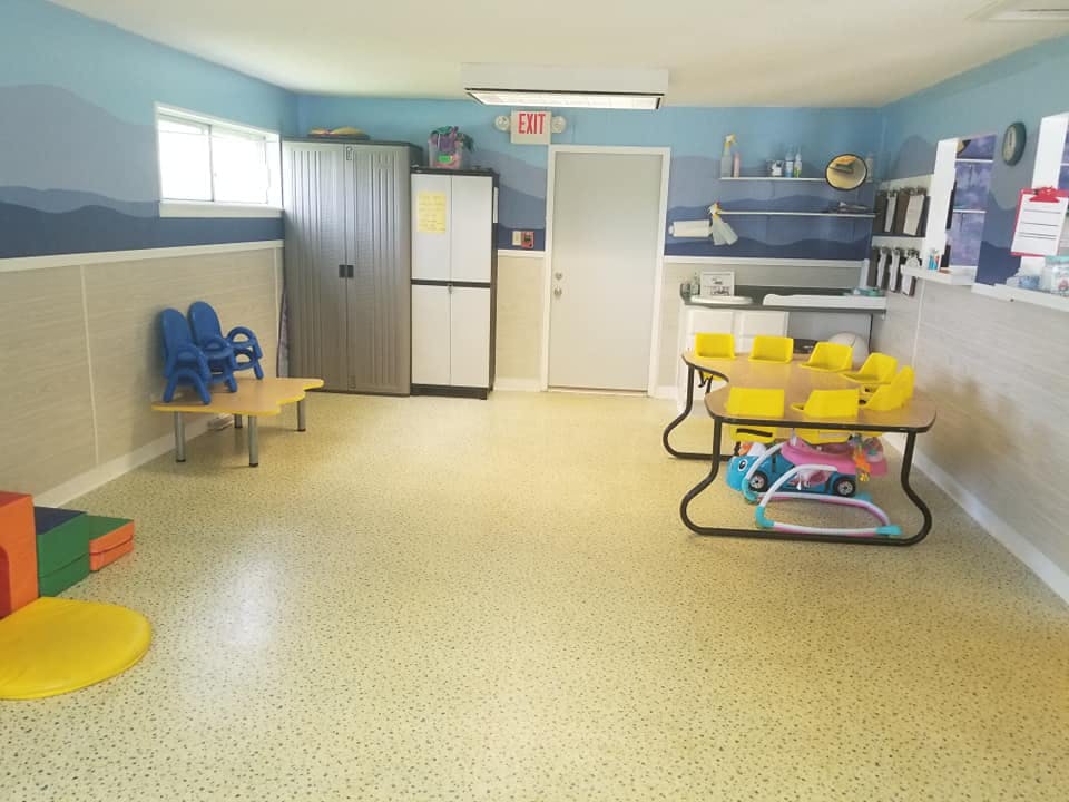 Playroom with small tables and chairs