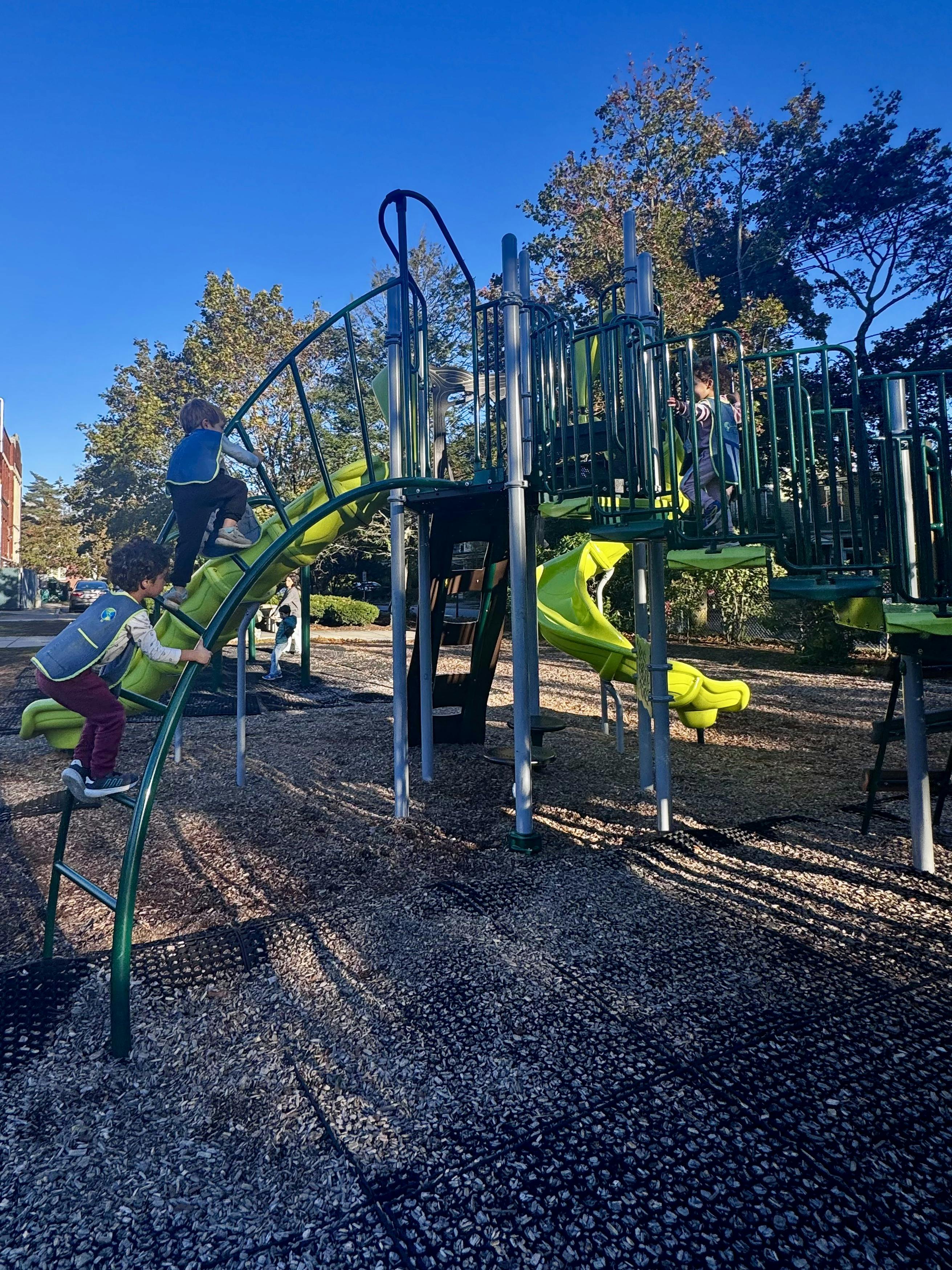 Children playing on a playground structure