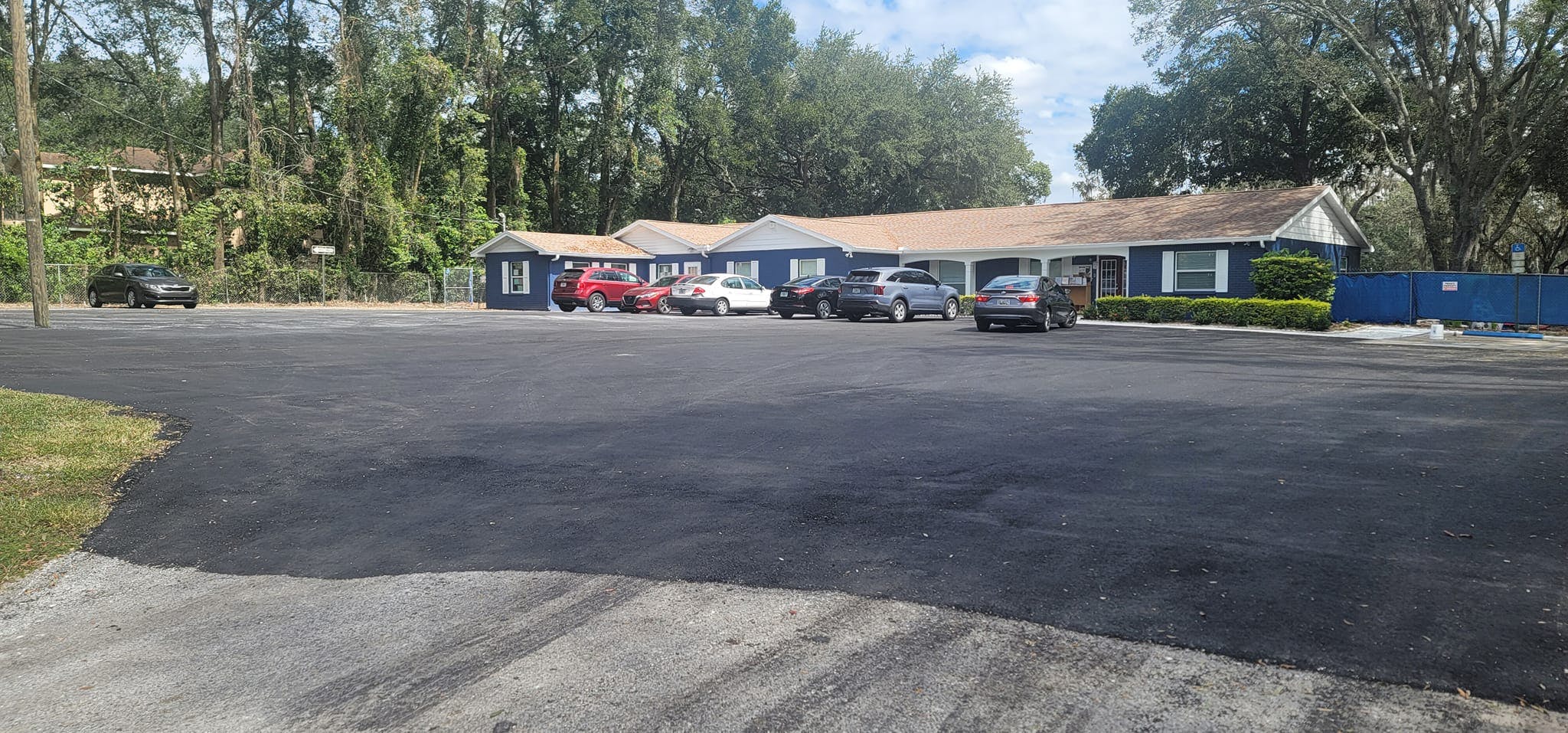 Building with cars parked in front